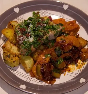 Kalfsschnitzels met zongedroogde tomaten-gremolata