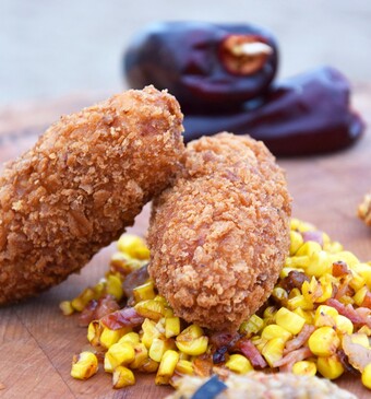 Inktviskroketjes met auberginepuree en mais