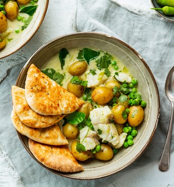 Curry met zeewolf, krieltjes en doperwten