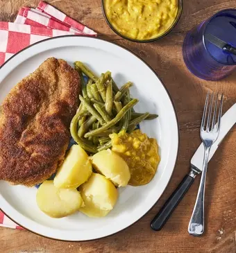 Gepaneerde kip met kerrie-ananas-saus