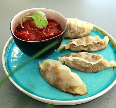 Gyoza dumplings van gekonfijte eend