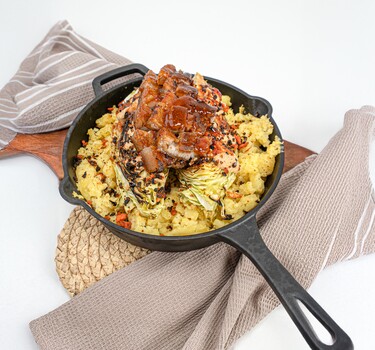 Varkenskotelet met aardappel van de BBQ